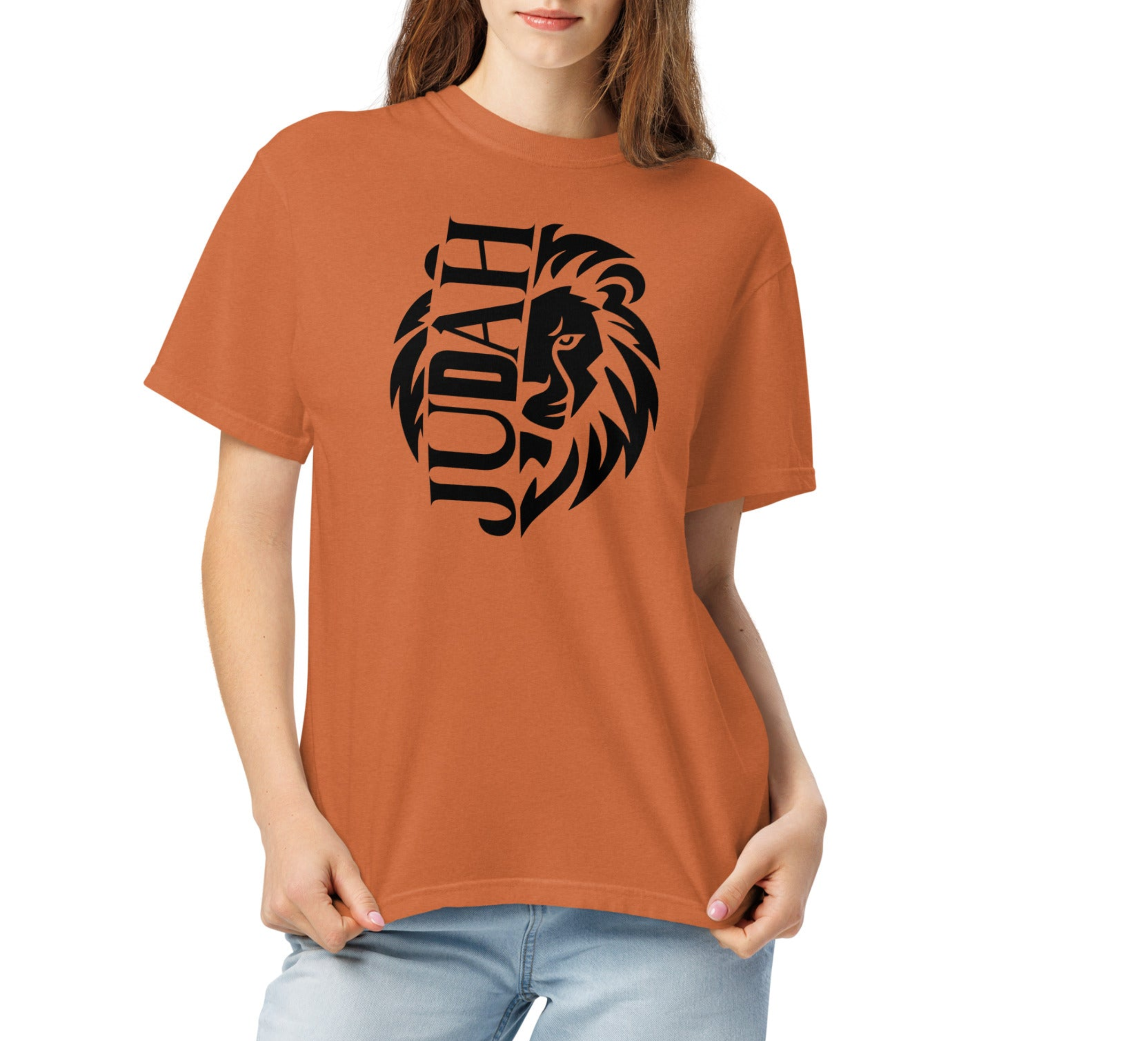 Person wearing a brown t-shirt with a lion graphic and 'Judah' text on a white background